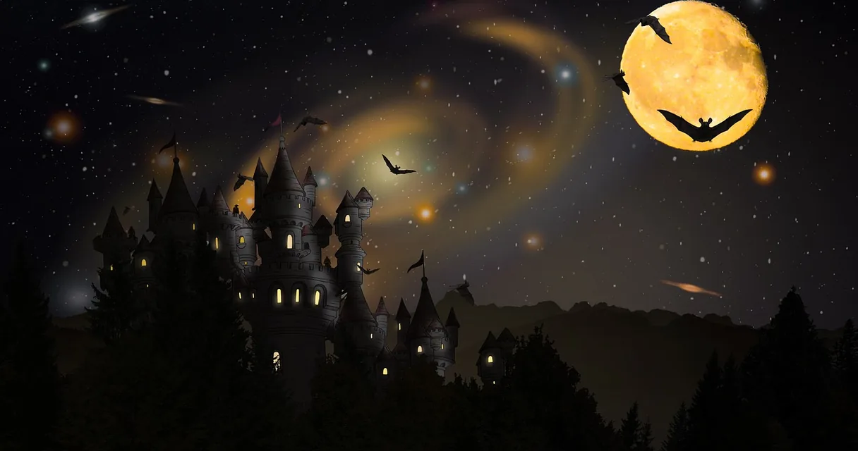Silhuetas de morcegos diante de uma lua cheia sobre um castelo no escuro, ilustrando sonhar com morcego