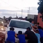 Brazil kids ditch school to free car from mud